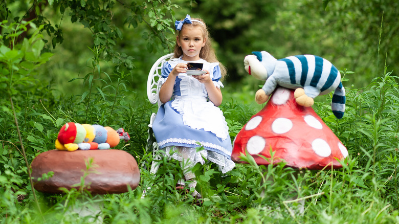 Girl dressed as Alice in Wonderland