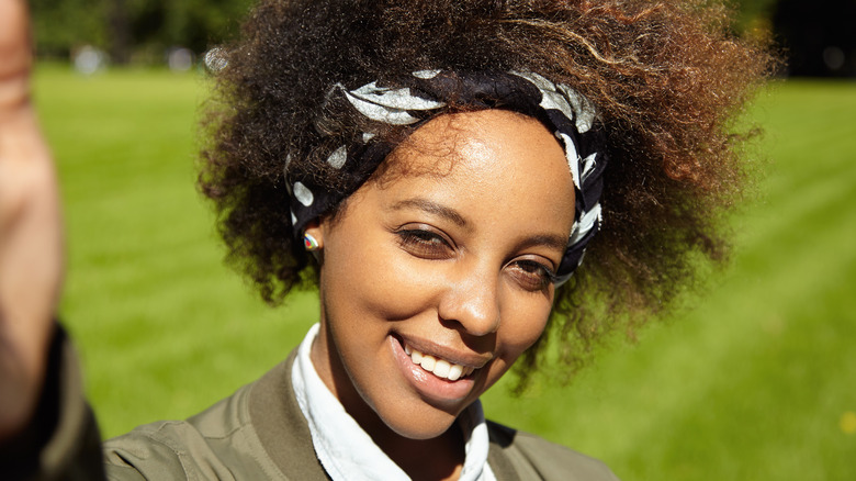 Woman squinting in sunshine