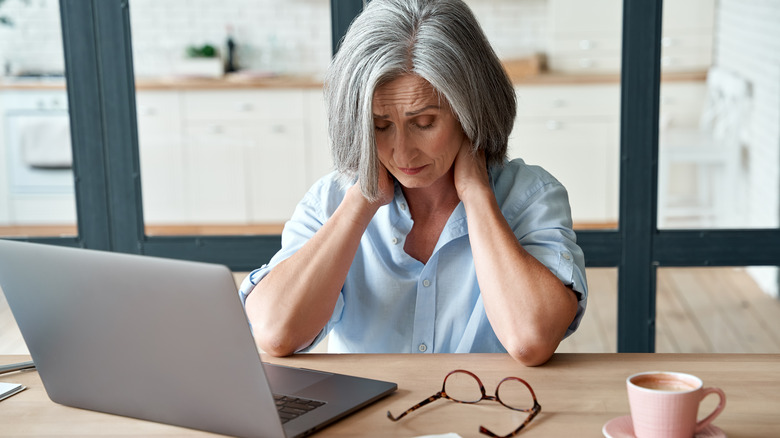 stressed woman at desk