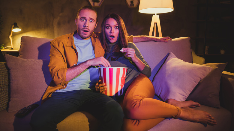 couple frightened watching TV