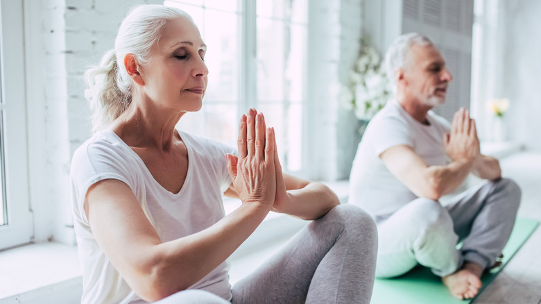 older people meditating