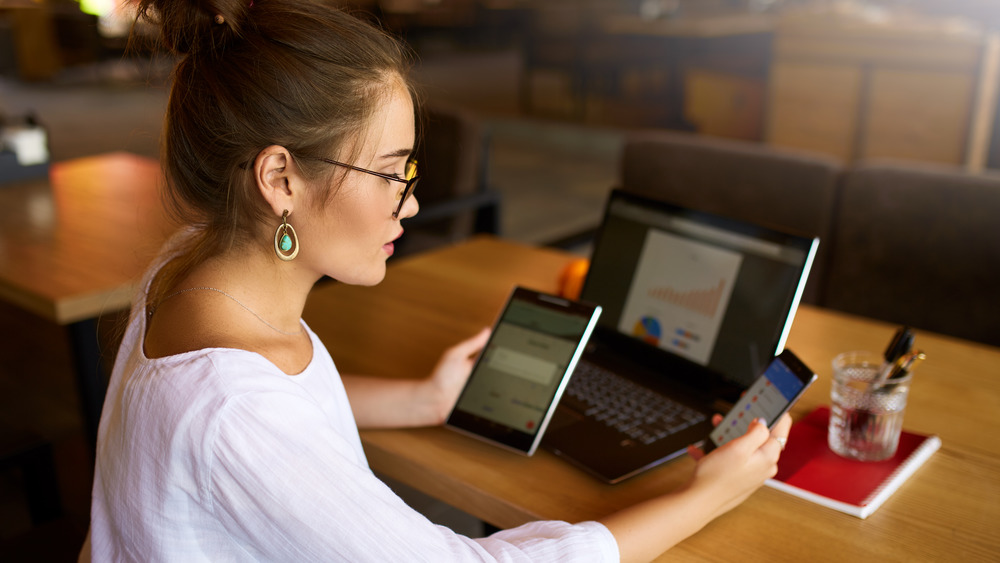 woman with multiple tech devices