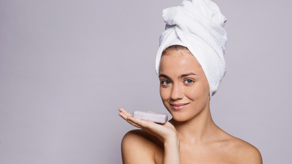 woman holding bar of soap