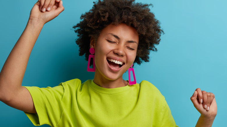 Energetic woman with blue background