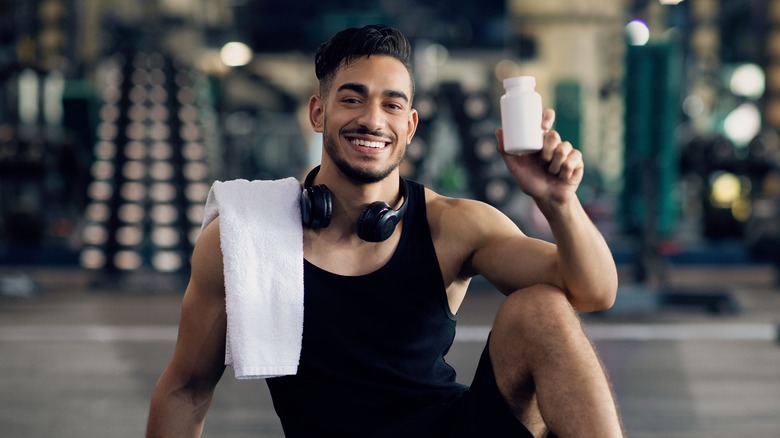 Man holding pill bottle