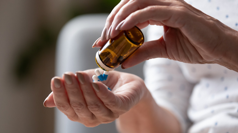 Woman with pill bottle