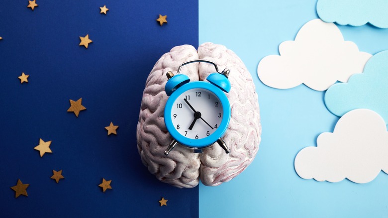 Clock on brain with sky background