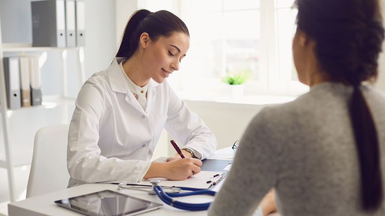 Woman visiting doctor