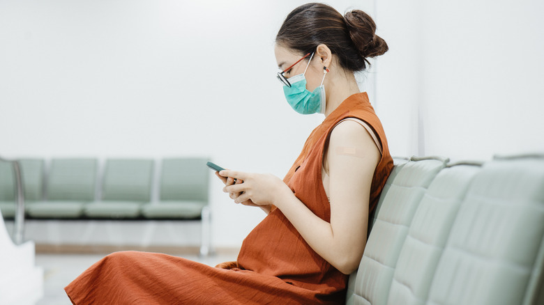 Woman during observation period after booster