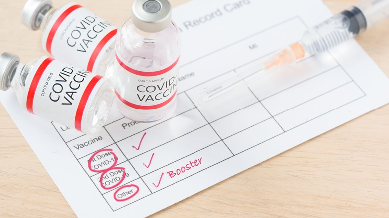 covid vaccine card with booster marked