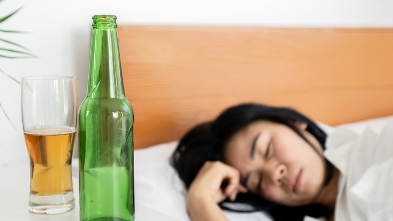 alcohol bottle next to bed