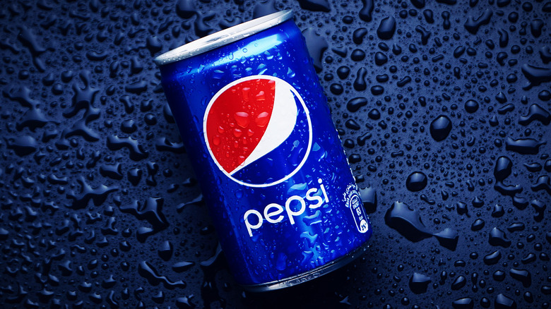 can of pepsi with blue background