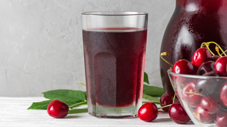 cherry juice in glass and pitcher