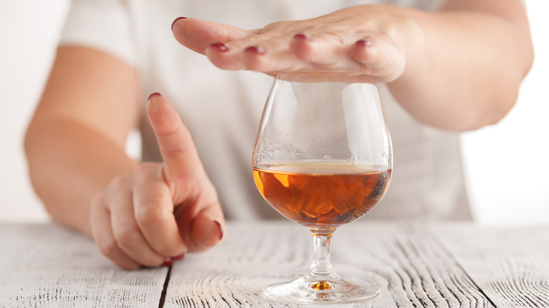 hands indicating "don't drink alcolhol"