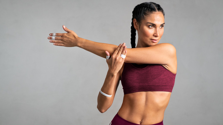 fit woman stretching