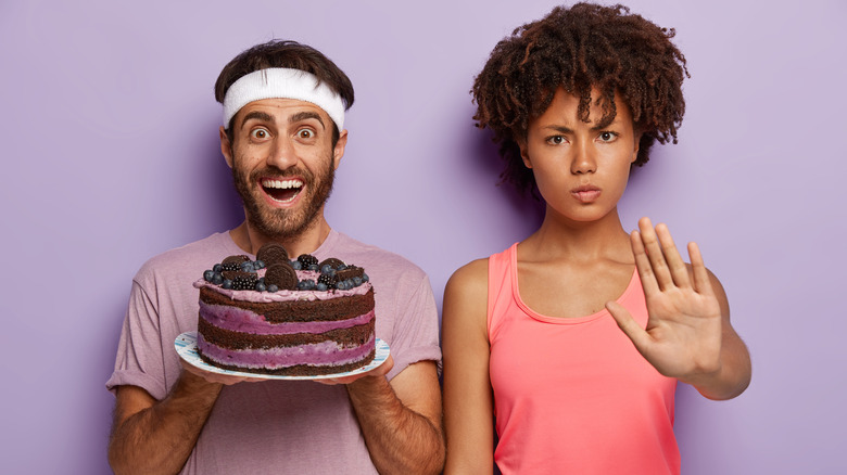 man with a cake, woman saying stop
