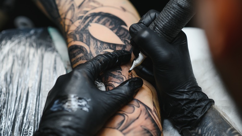 Person getting tattooed