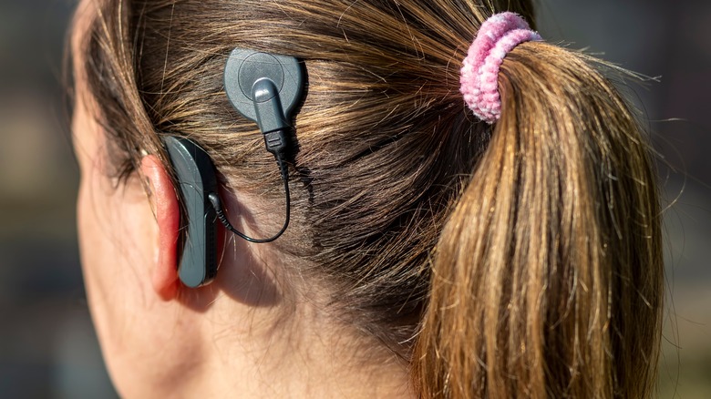person with cochlear implant