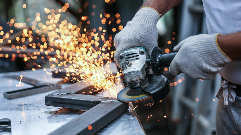 person working with metal