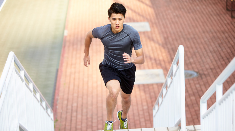 man running up stairs