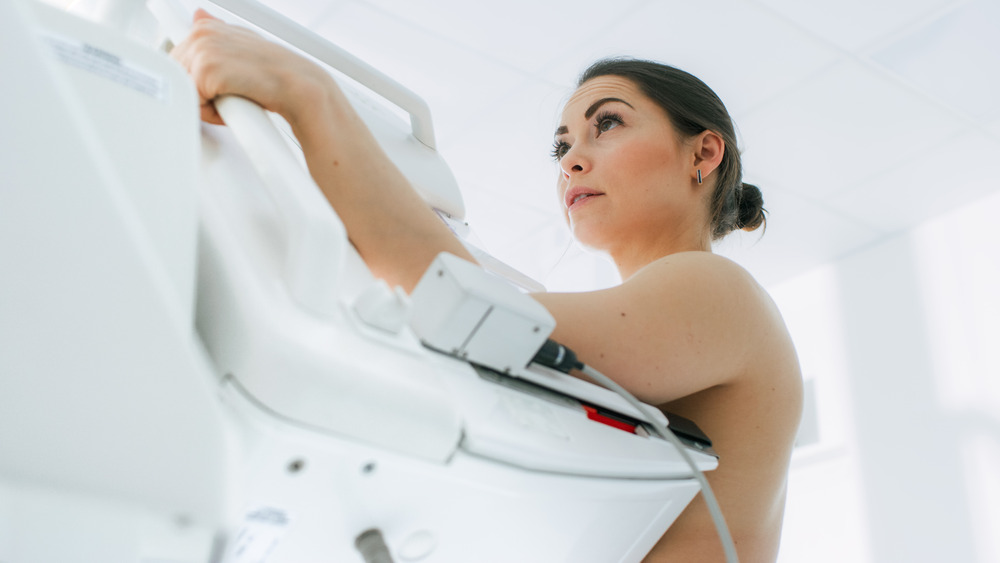 woman getting mammogram