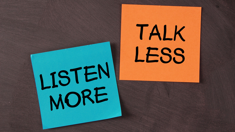 A blue sticky note that says "LISTEN MORE" next to an orange sticky note that says "TALK LESS"