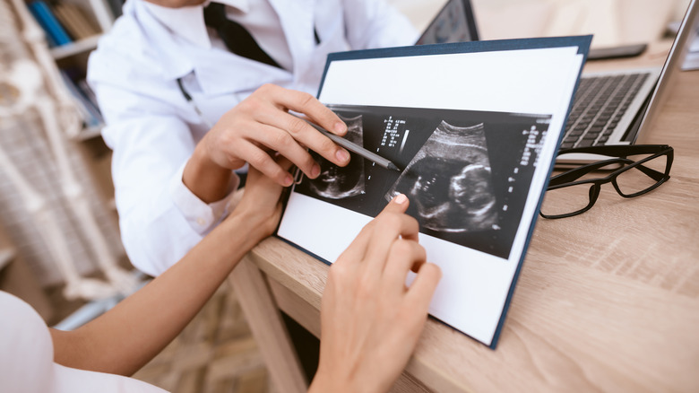 pregnant woman looking at ultrasound