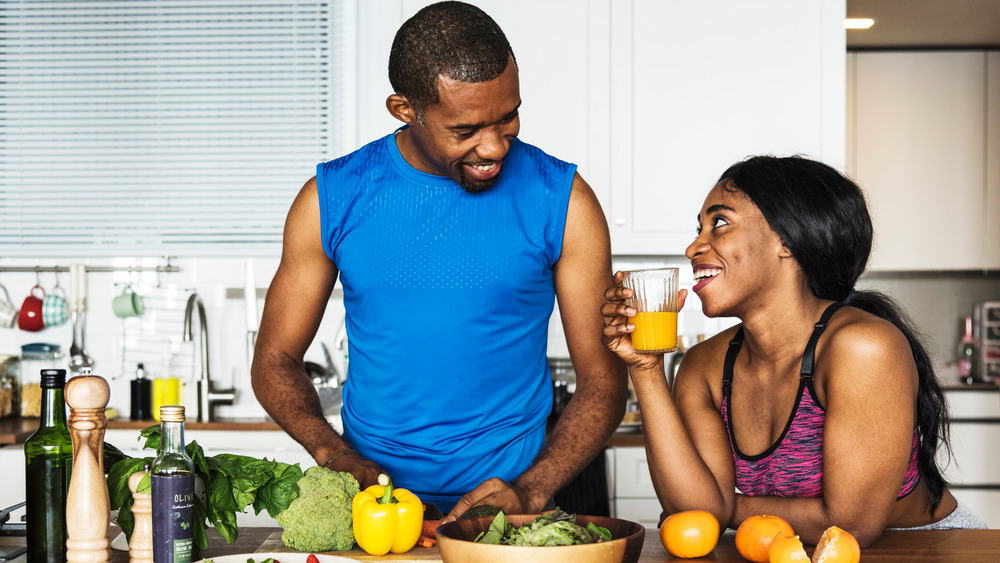 couple enjoying meal preparation together