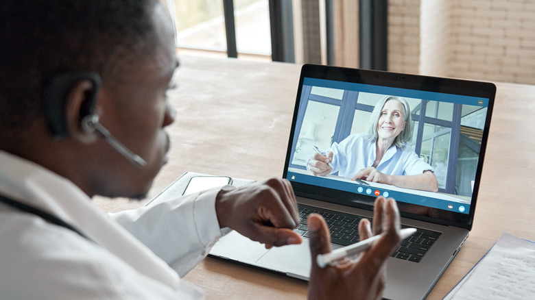 doctor consults with patient