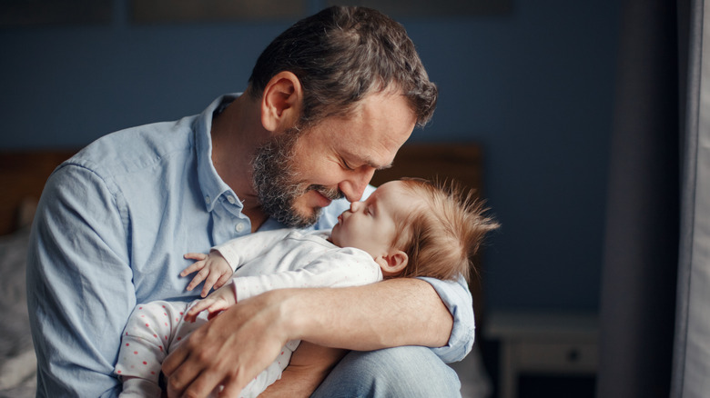 dad and newborn baby