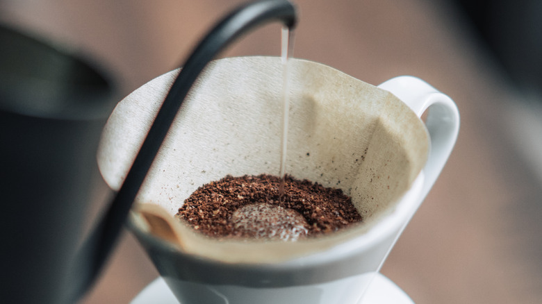 coffee being poured into cup