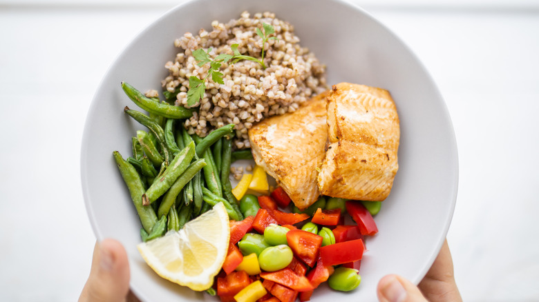 Plate with healthy food portioned on it