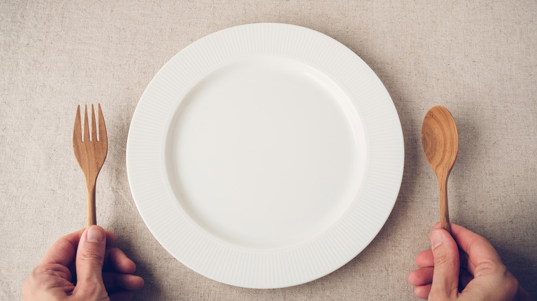Empty plate with fork and spoon 