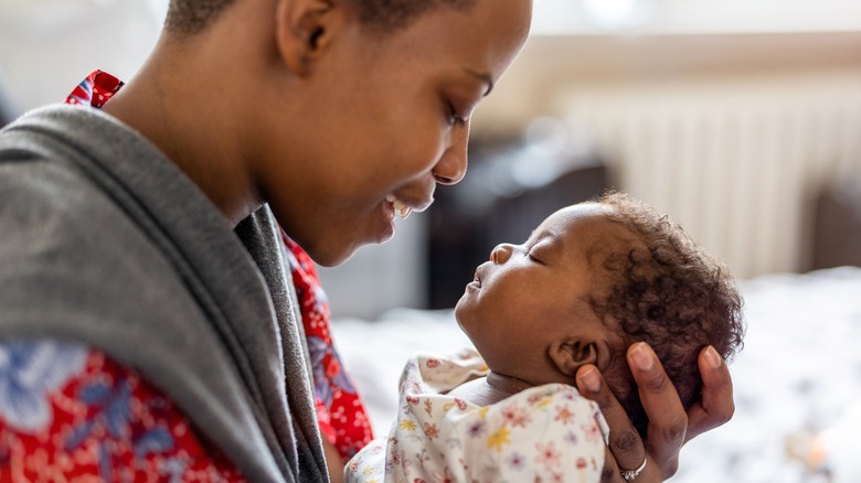 young mom holding baby