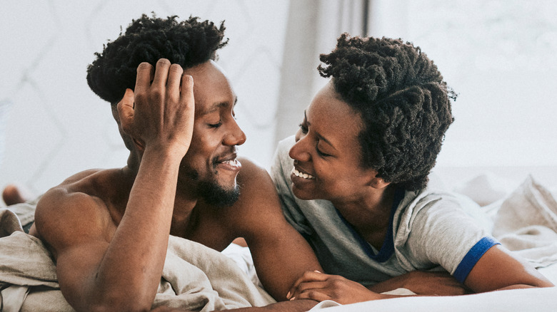 couple smiling in bed