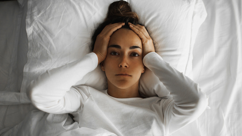 Woman unable to sleep in bed