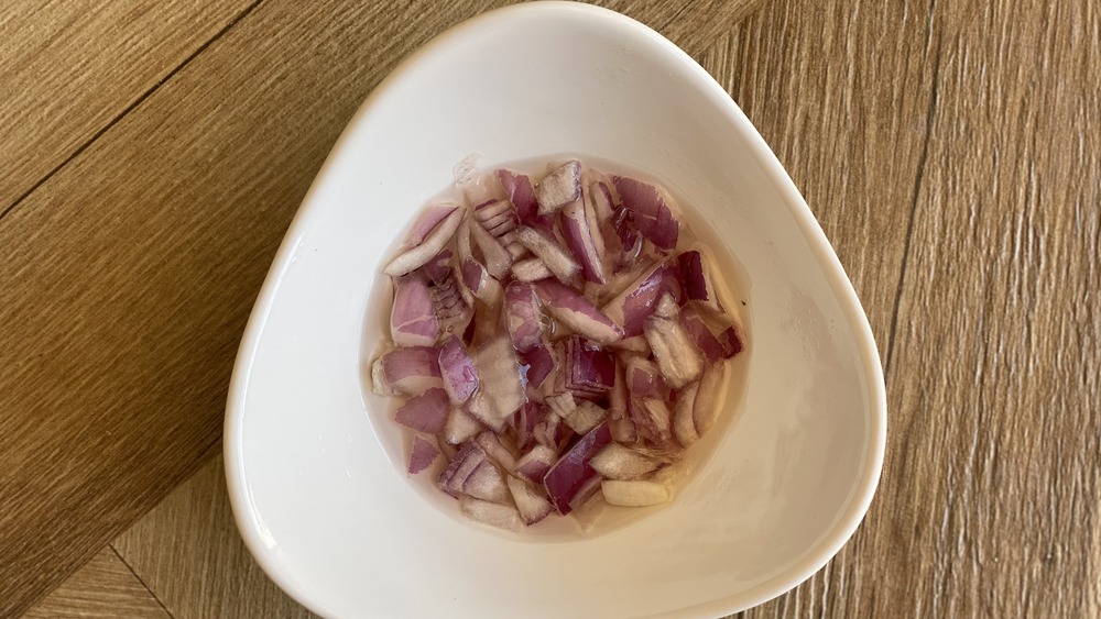 marinating onions in a bowl