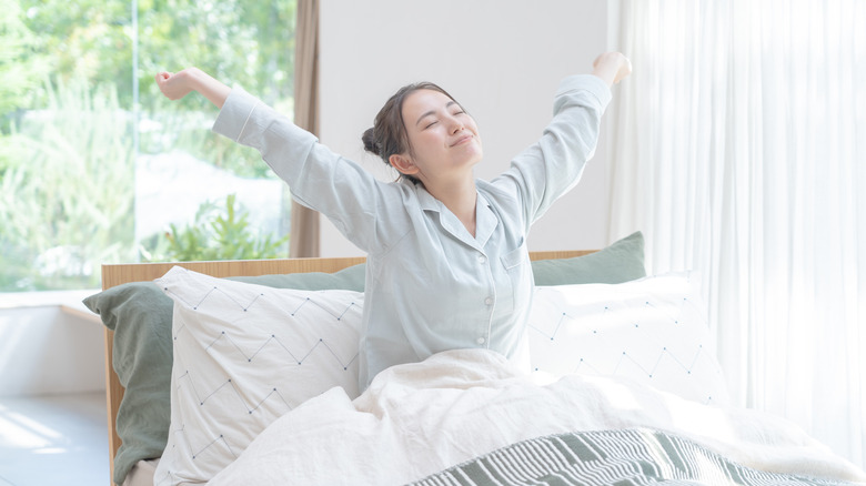 woman waking up refreshed