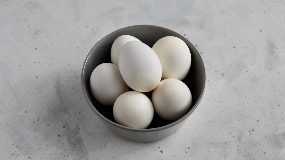 Hard boiled eggs in a grey bowl for healthy egg salad