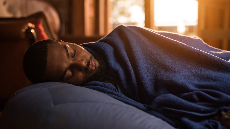 Man fast asleep in bed