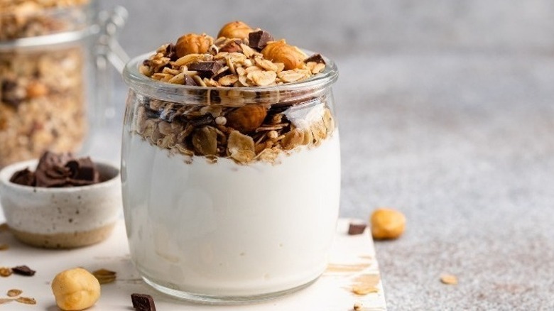 yogurt topped with nuts, oats, and seeds