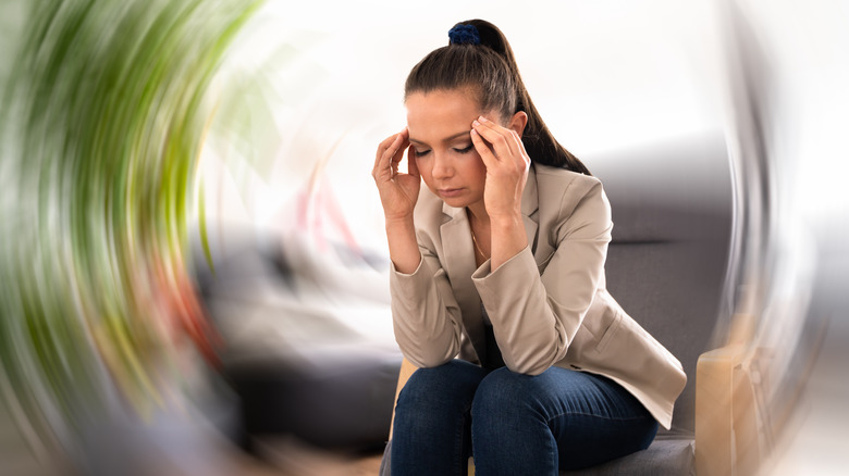 woman experiencing dizziness