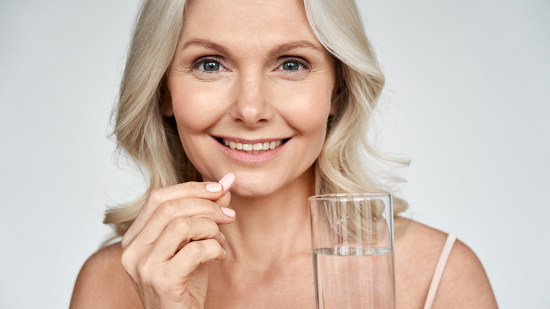 woman taking medication