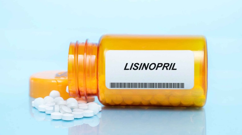 woman taking lisinopril medication