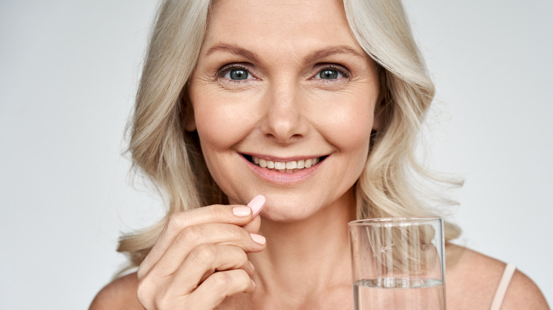 woman taking Pepcid medication