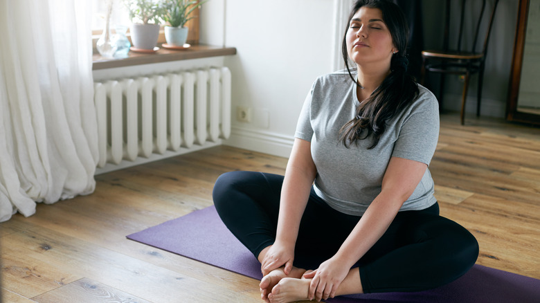 woman doing butterfly stretch