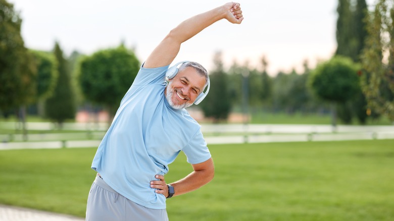 man doing side stretch