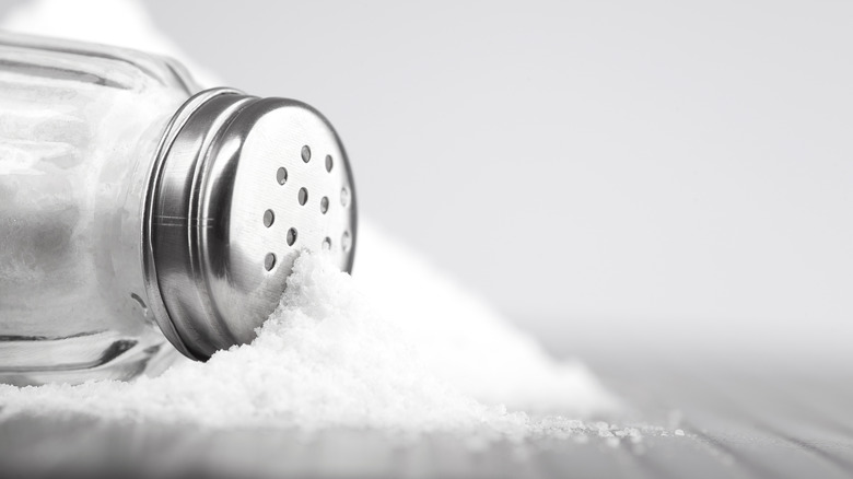 A salt shaker on a gray background