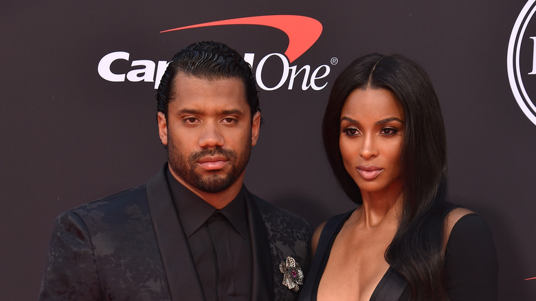 Ciara and husband Russell Wilson posing on the red carpet