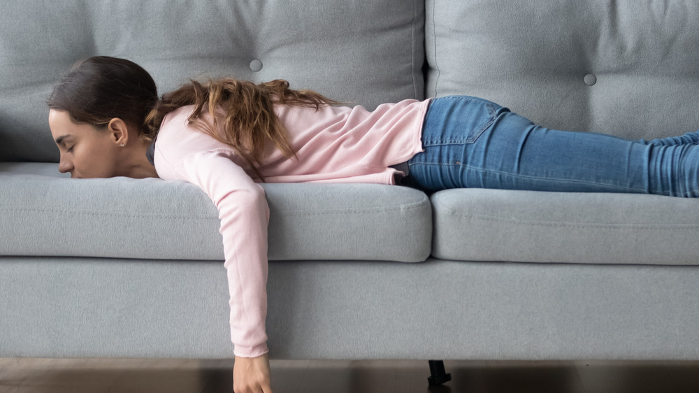 girl face down on couch